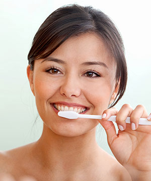 girl brushing her teeth